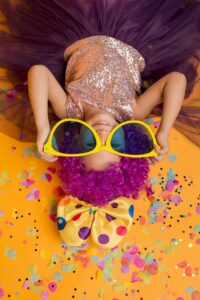 top-view-cute-girl-with-big-sunglasses-confetti art factory lab